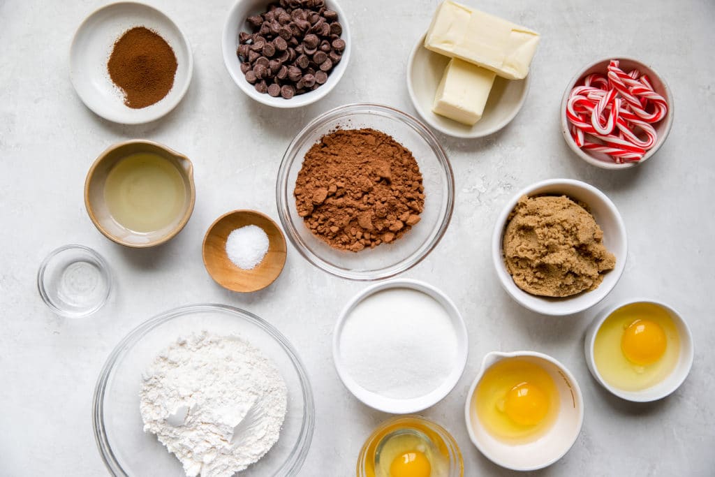 ingredients to make brownies in small glass bowls