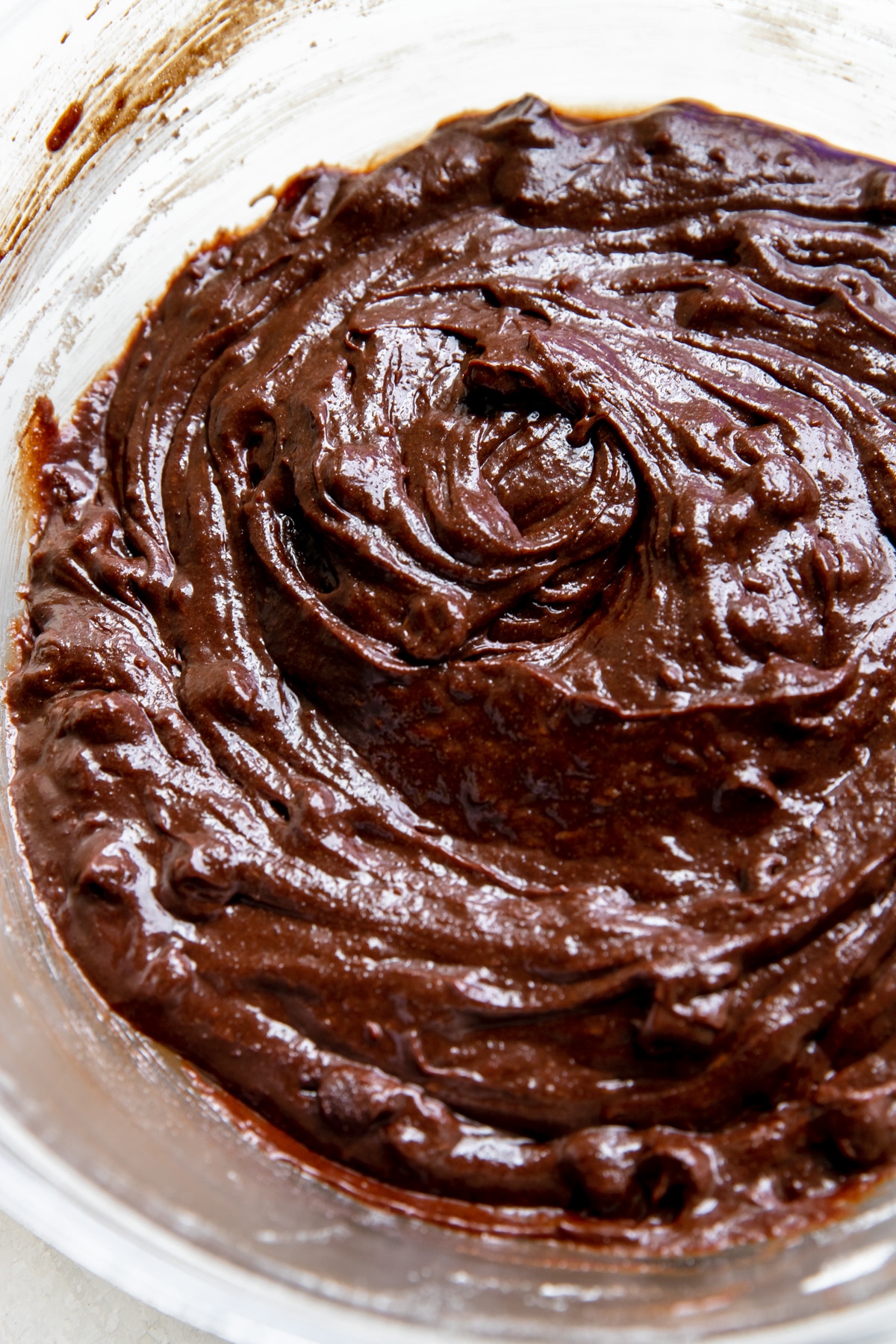 brownie batter in a glass mixing bowl
