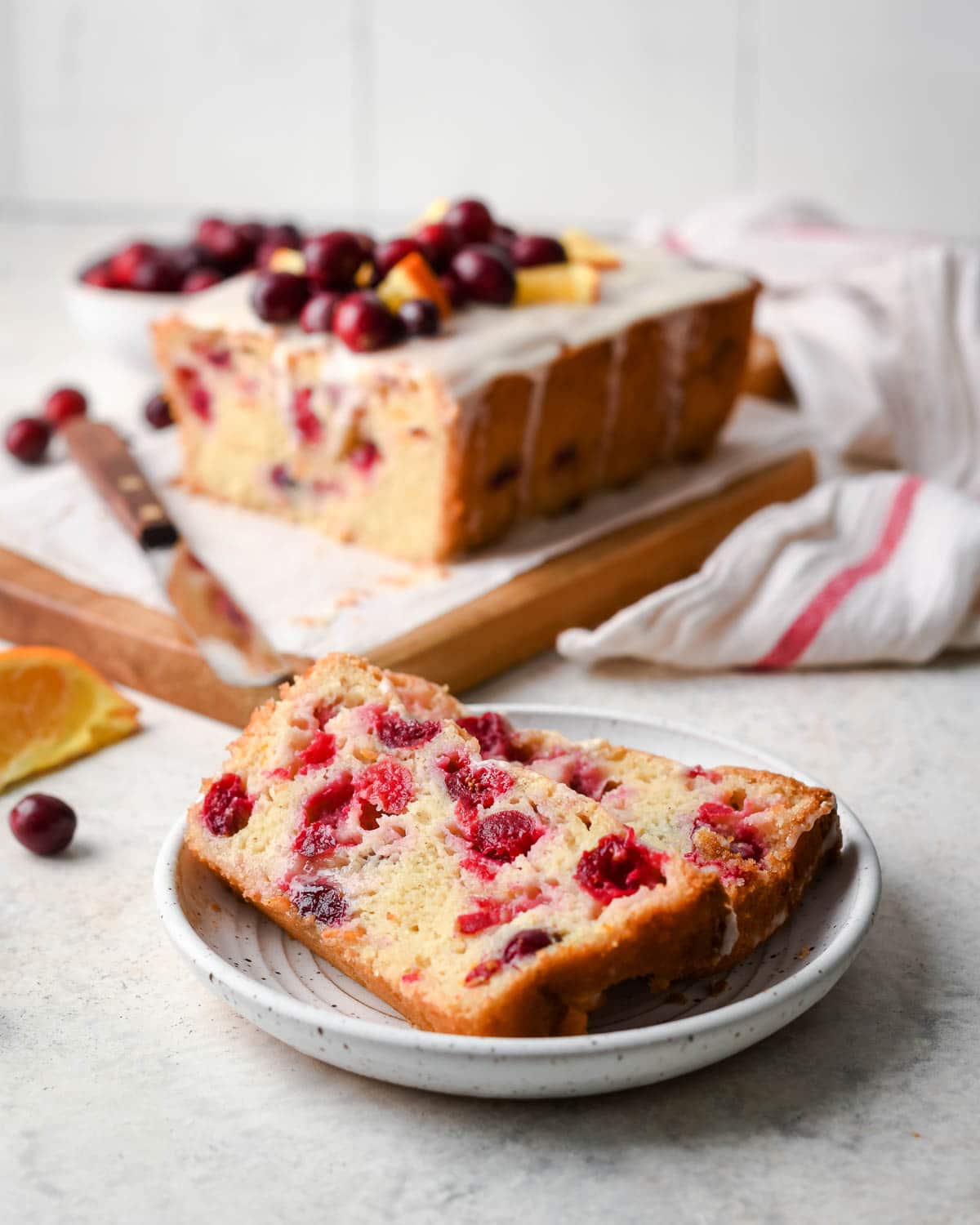 cranberry orange bread on a white plate