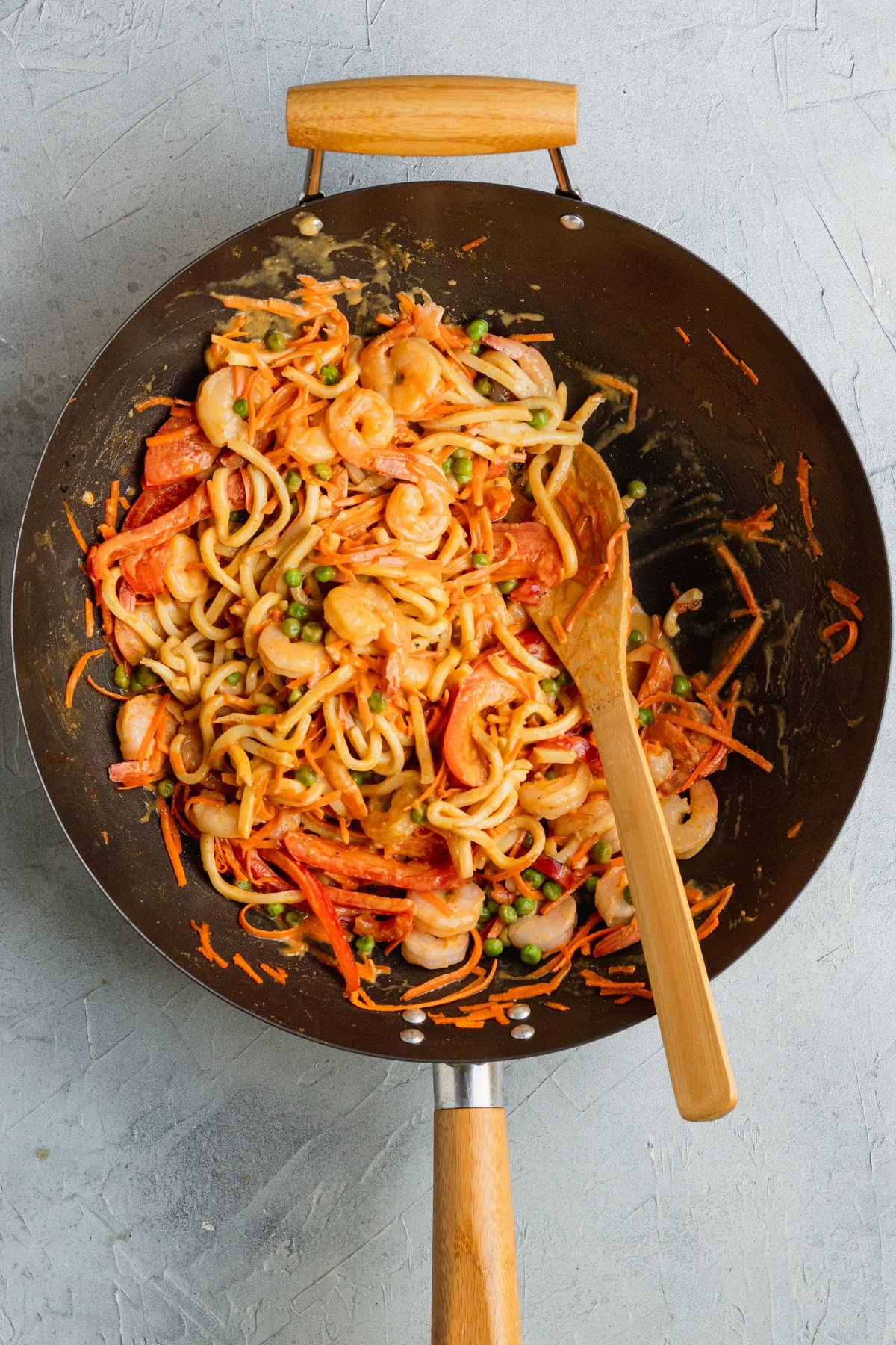 noodles, shrimp and veggies in a wok