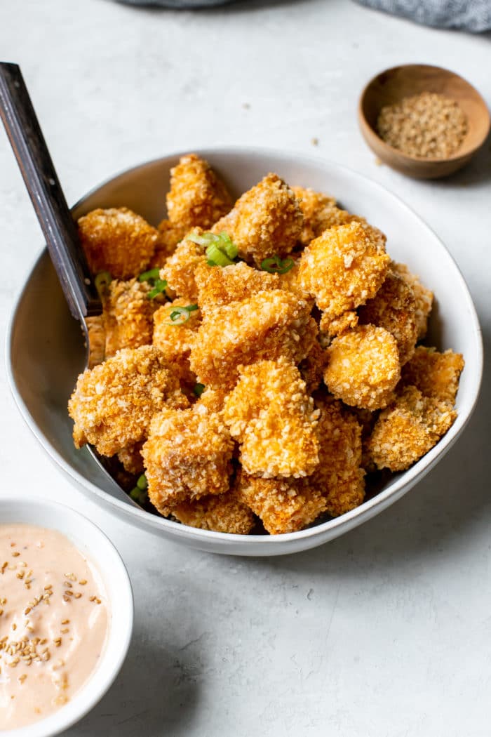 salmon coated in toasted Panko breadcrumbs in a white bowl