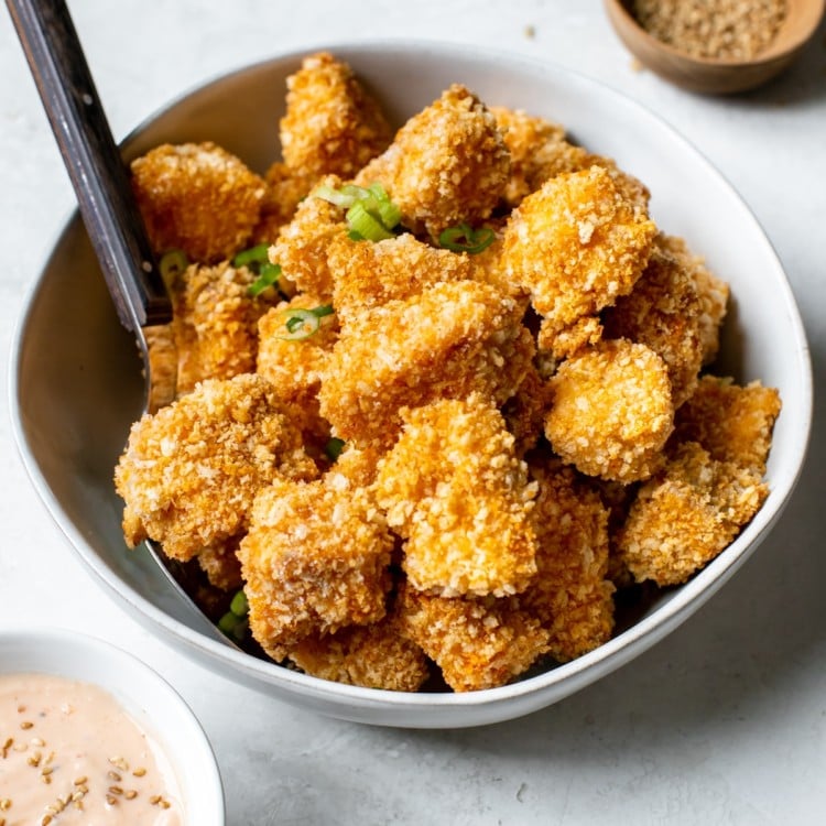 salmon coated in toasted Panko breadcrumbs in a white bowl