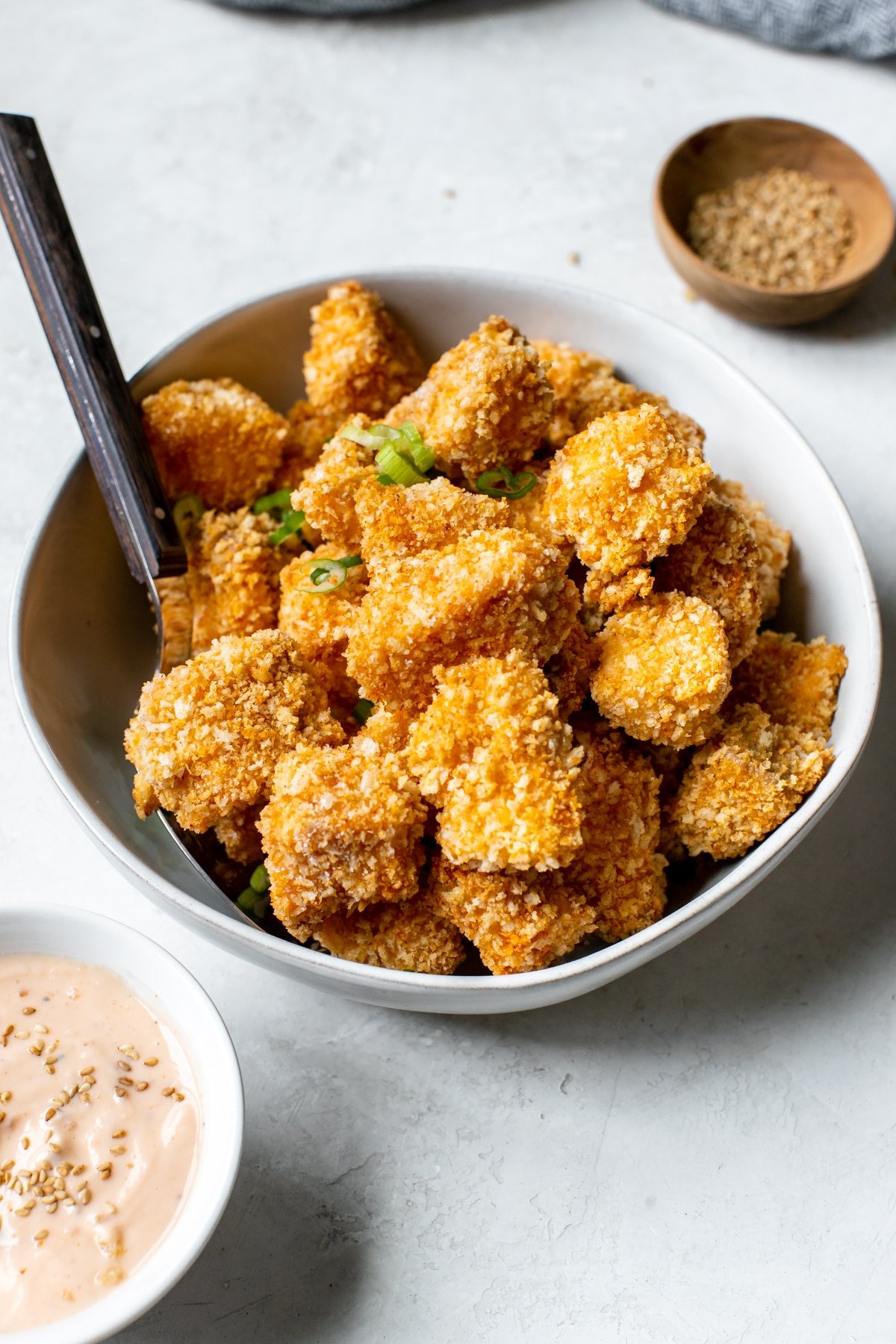 salmon coated in toasted Panko breadcrumbs in a white bowl