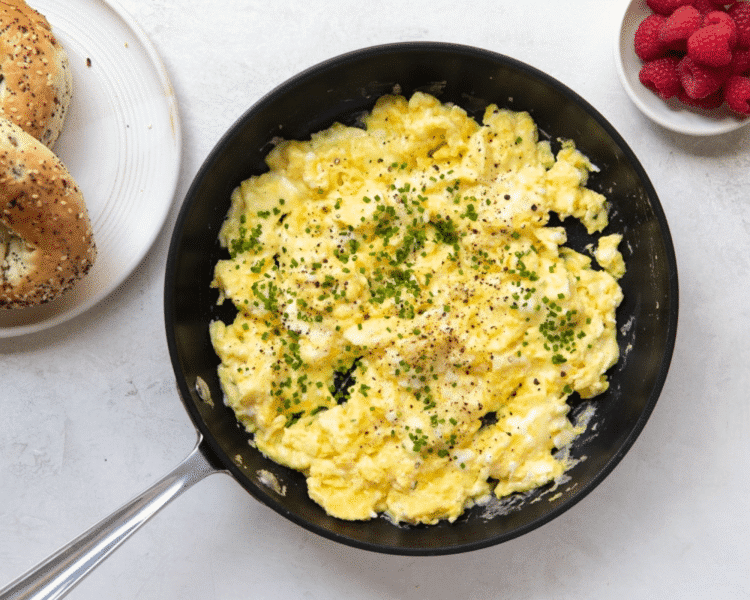 Preparing scrambled eggs for breakfast burritos.