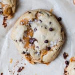 cookies made with caramel and chocolate chips on parchment paper