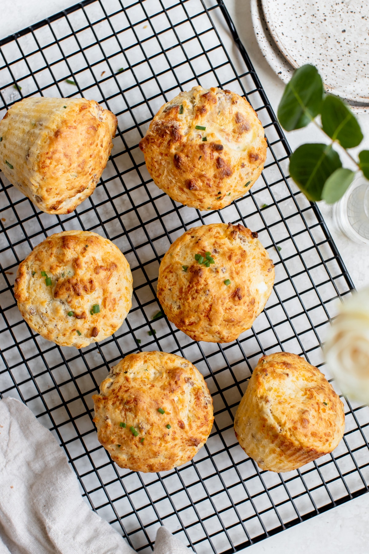 freshly baked breakfast muffins on a black cooling rack