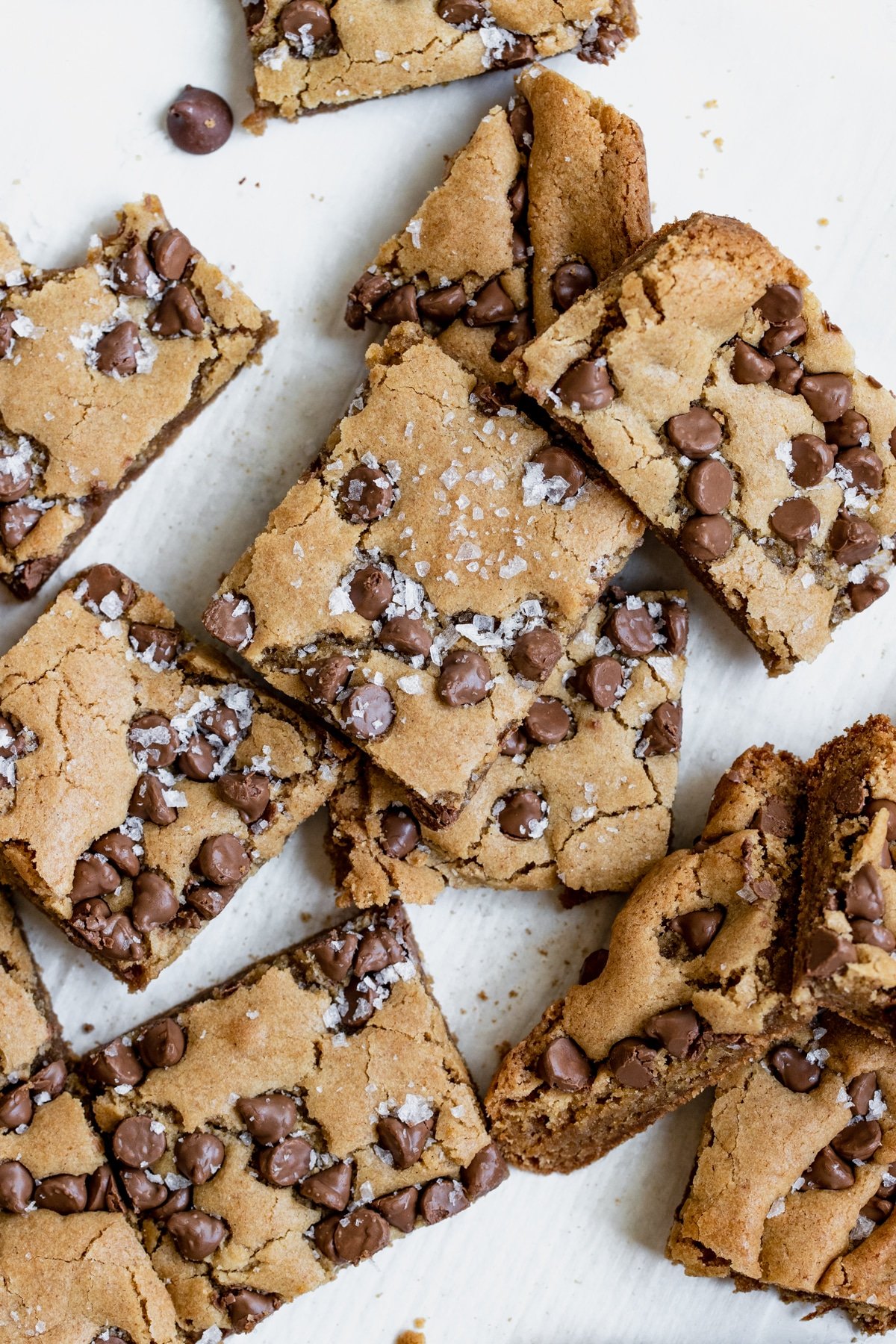 blondies cut into bars with salt on top and chocolate chips