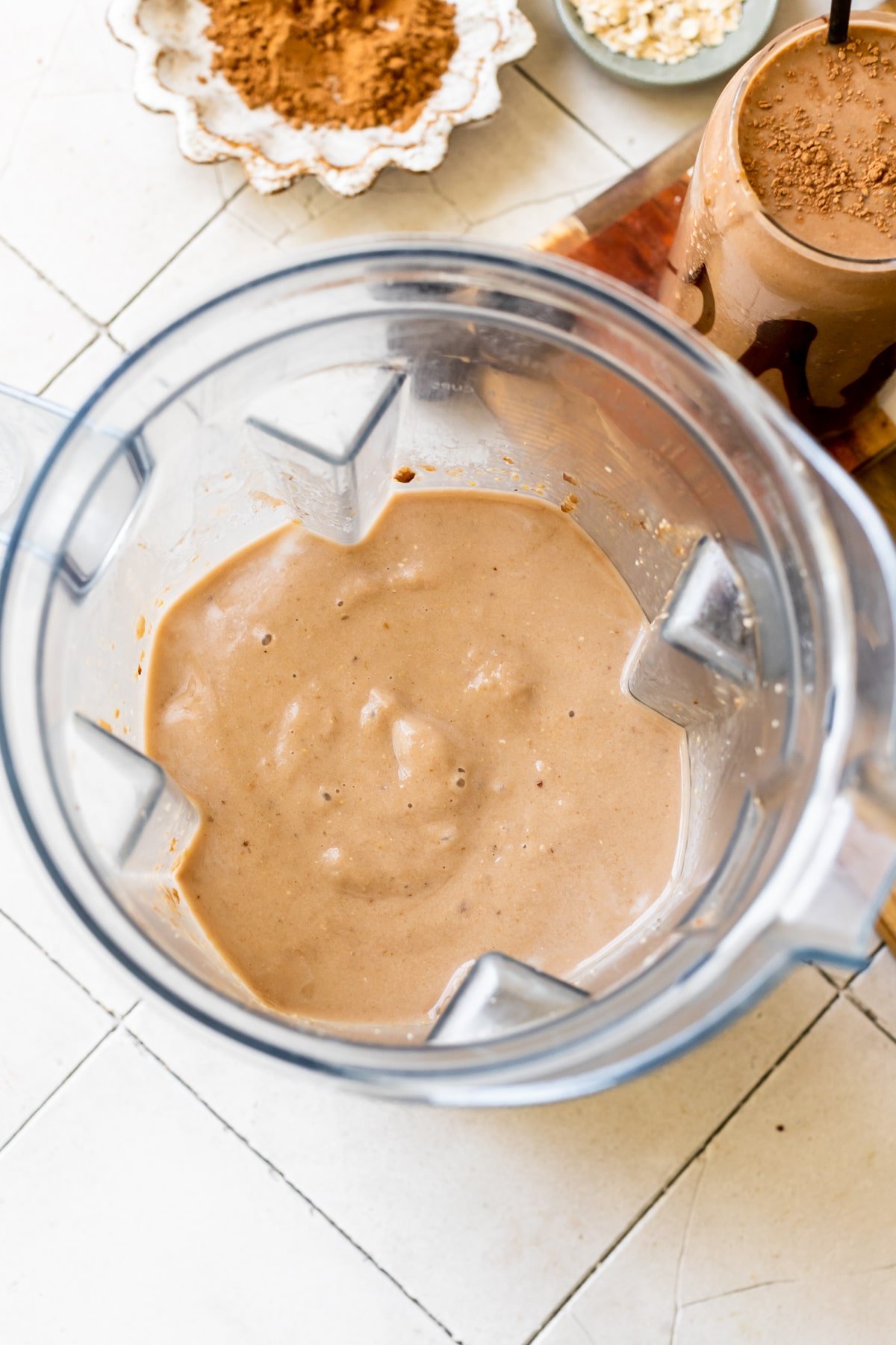 a creamy chocolate smoothie blended up in a blender