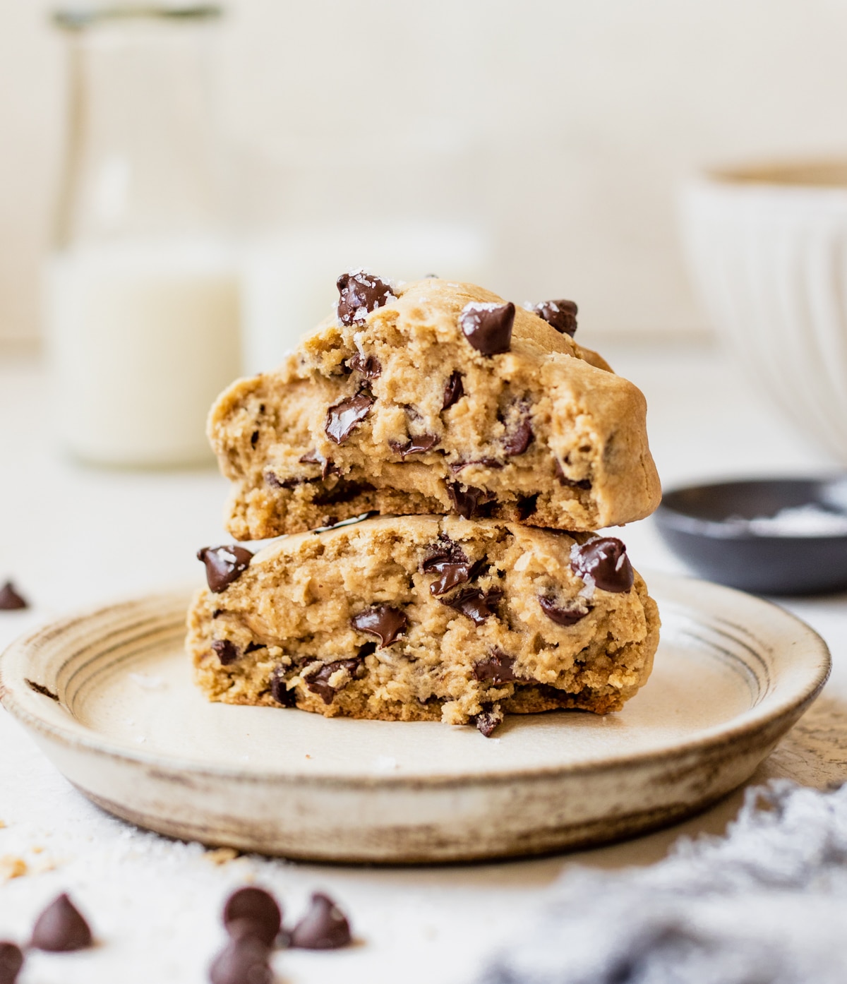 a cookie on a plate topped with flaky sea salt.