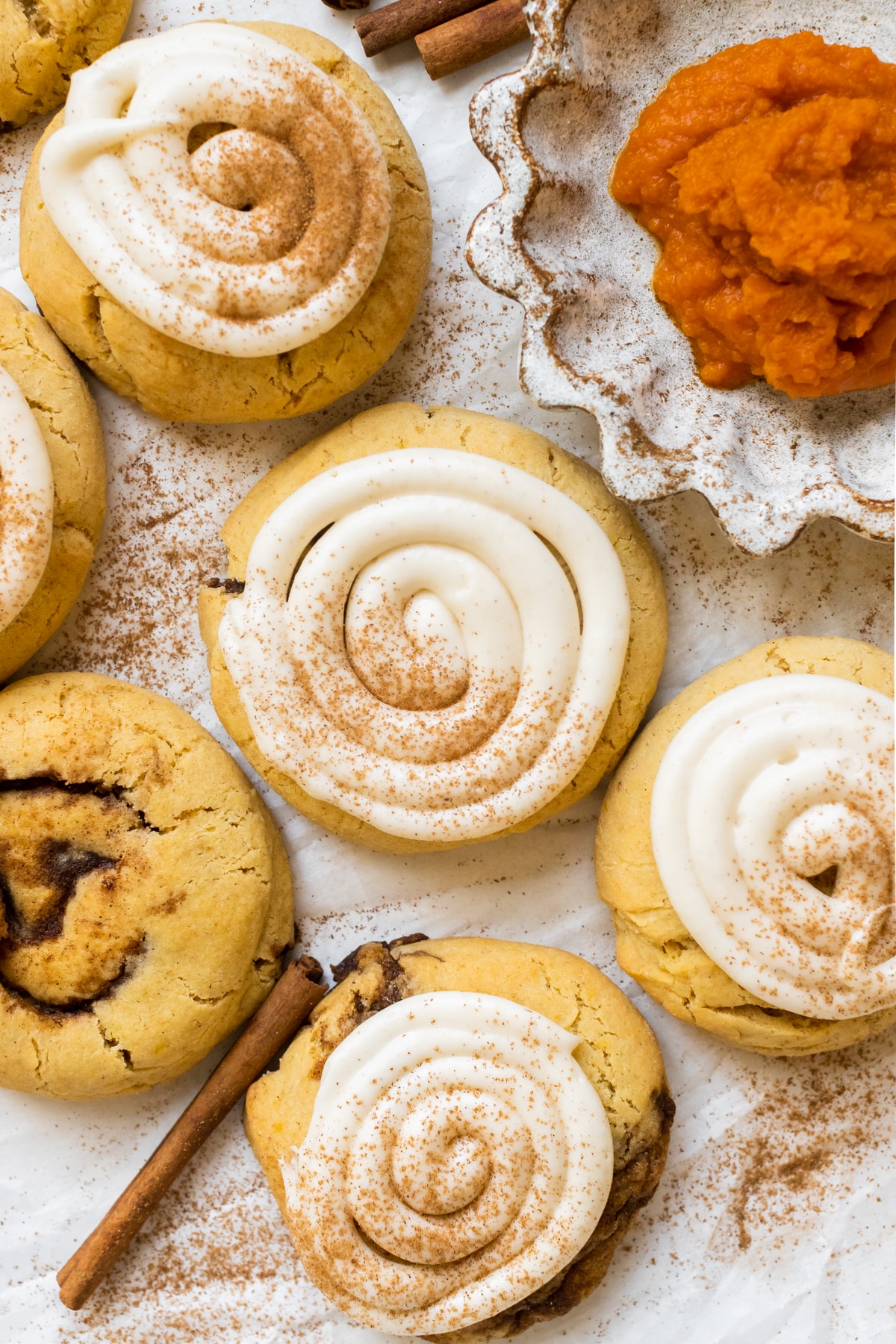 cookies made with pumpkin with cream cheese frosting on top