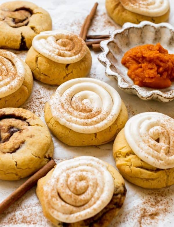 pumpkin cookies topped with cream cheese frosting and pumpkin pie spice.