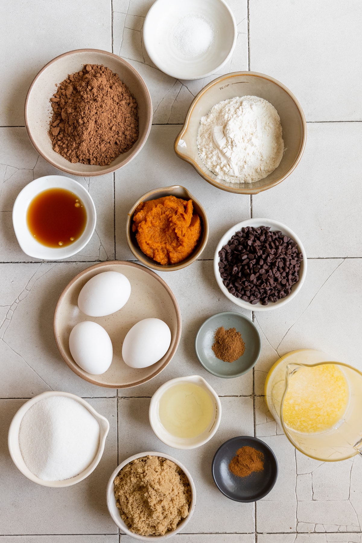 ingredients needed to make brownies in small  glass bowls. 