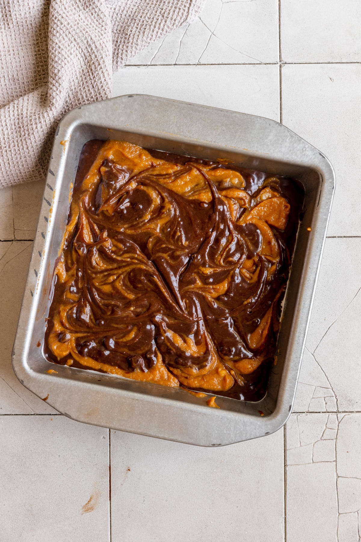 brownie batter with pumpkin swirled in on top. 