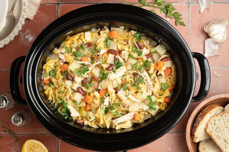 cooked chicken noodle soup in crockpot