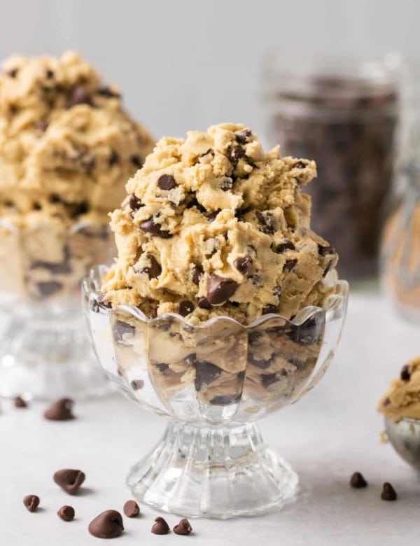 cookie dough with chocolate chips in a glass bowl.