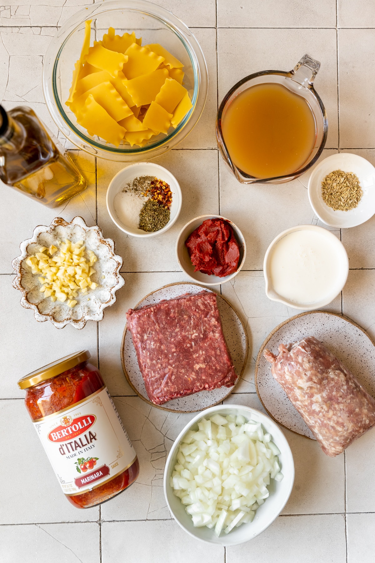 ingredients to make soup in small white bowls. 