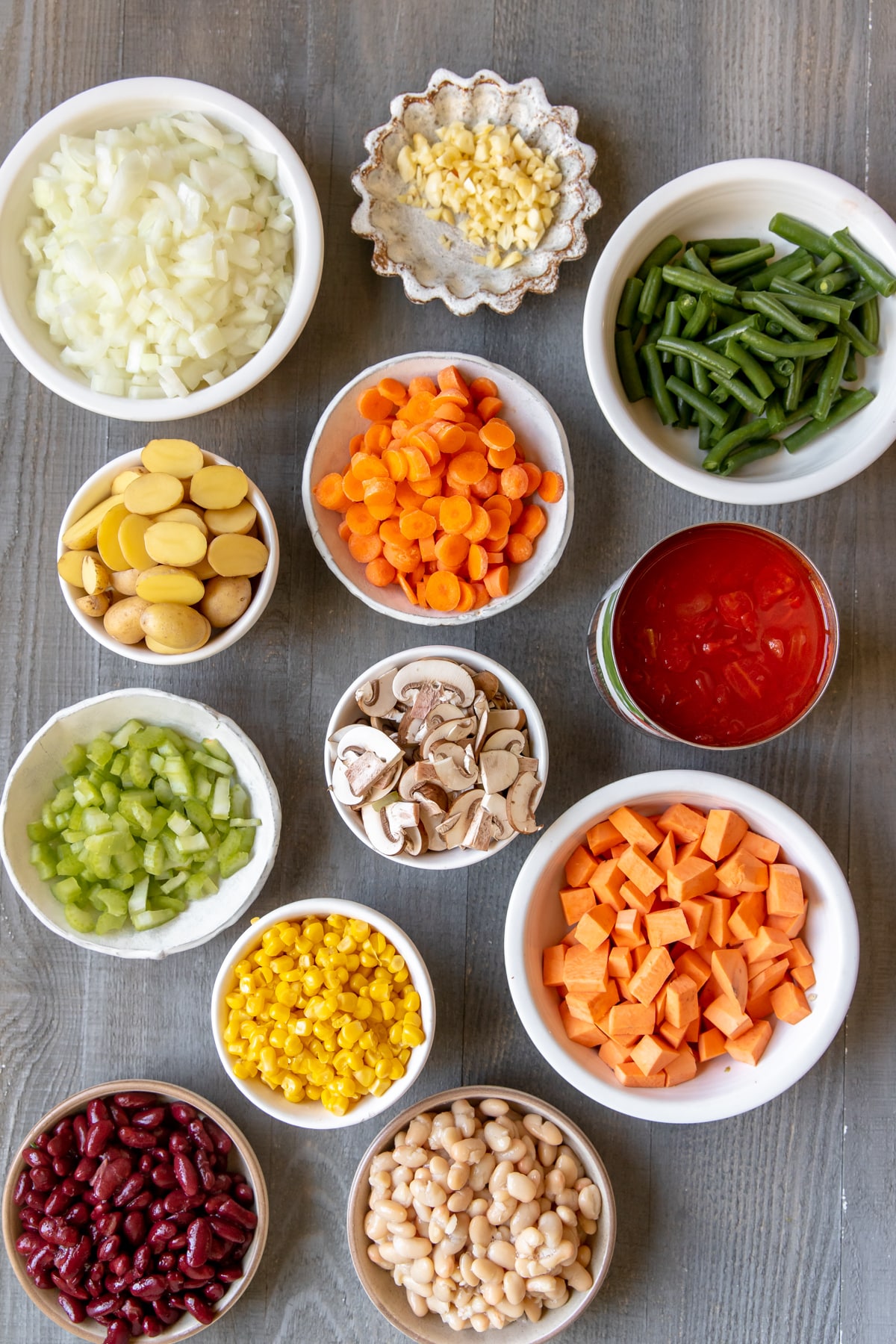 vegetables in small white bowls. 