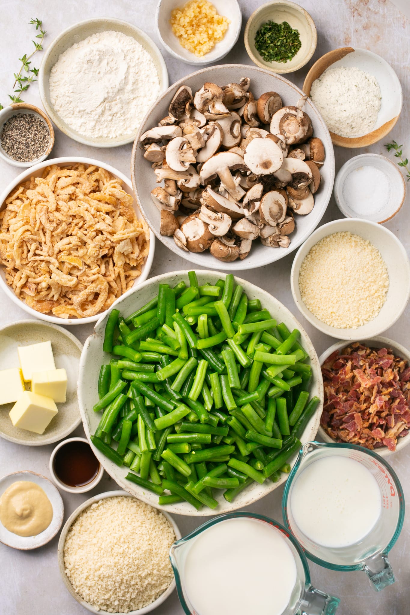 ingredients in individual small dishes to make a casserole made with green beans 
