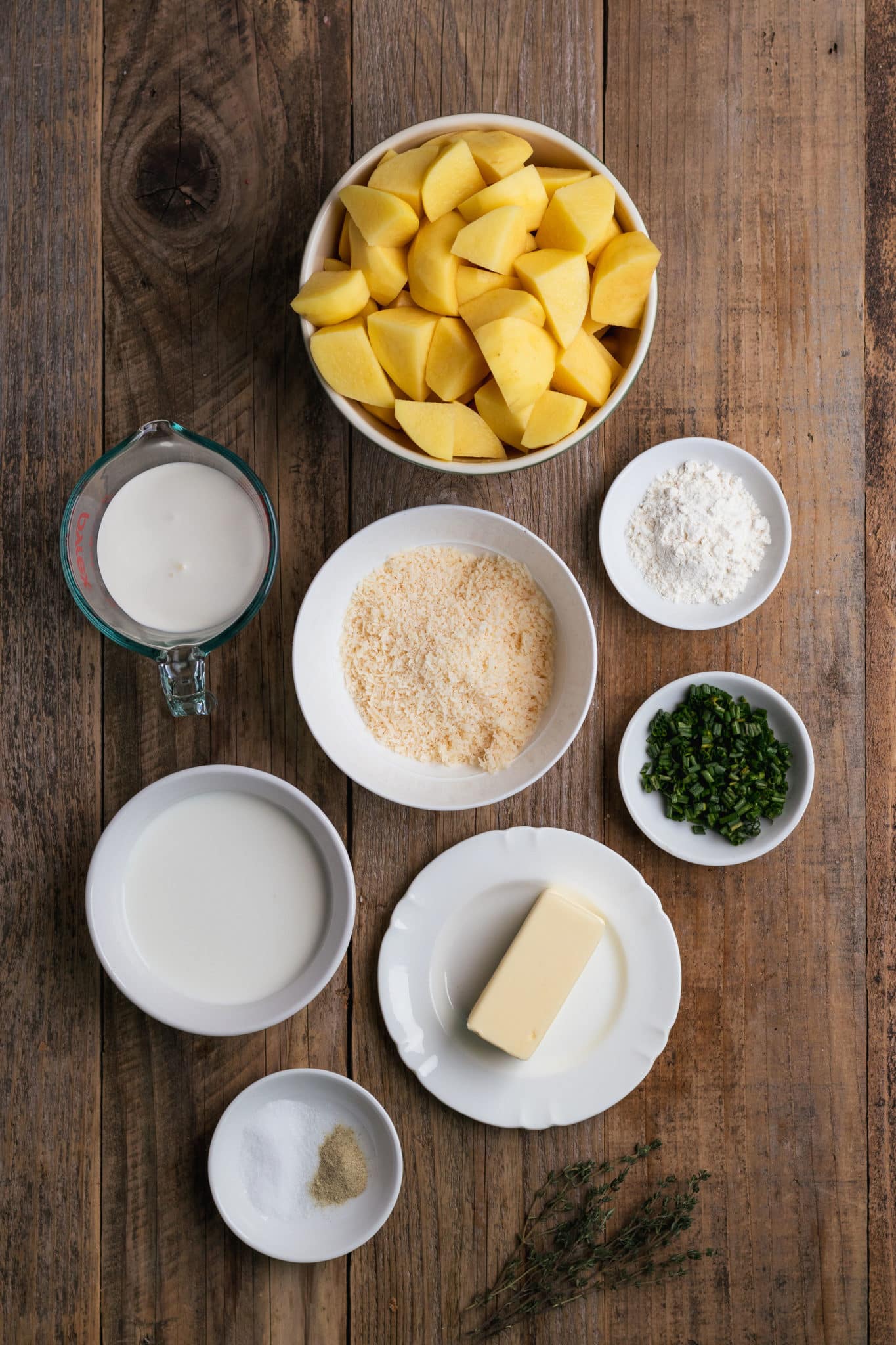 ingredients for potatoes in small white bowls.