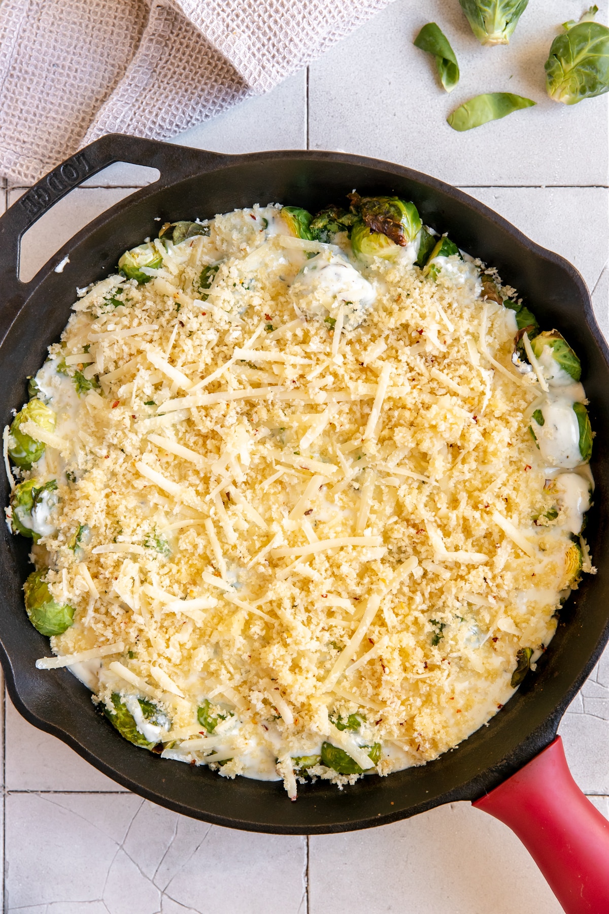 a cream sauce in a cast iron skillet smothered over Brussels sprouts. 