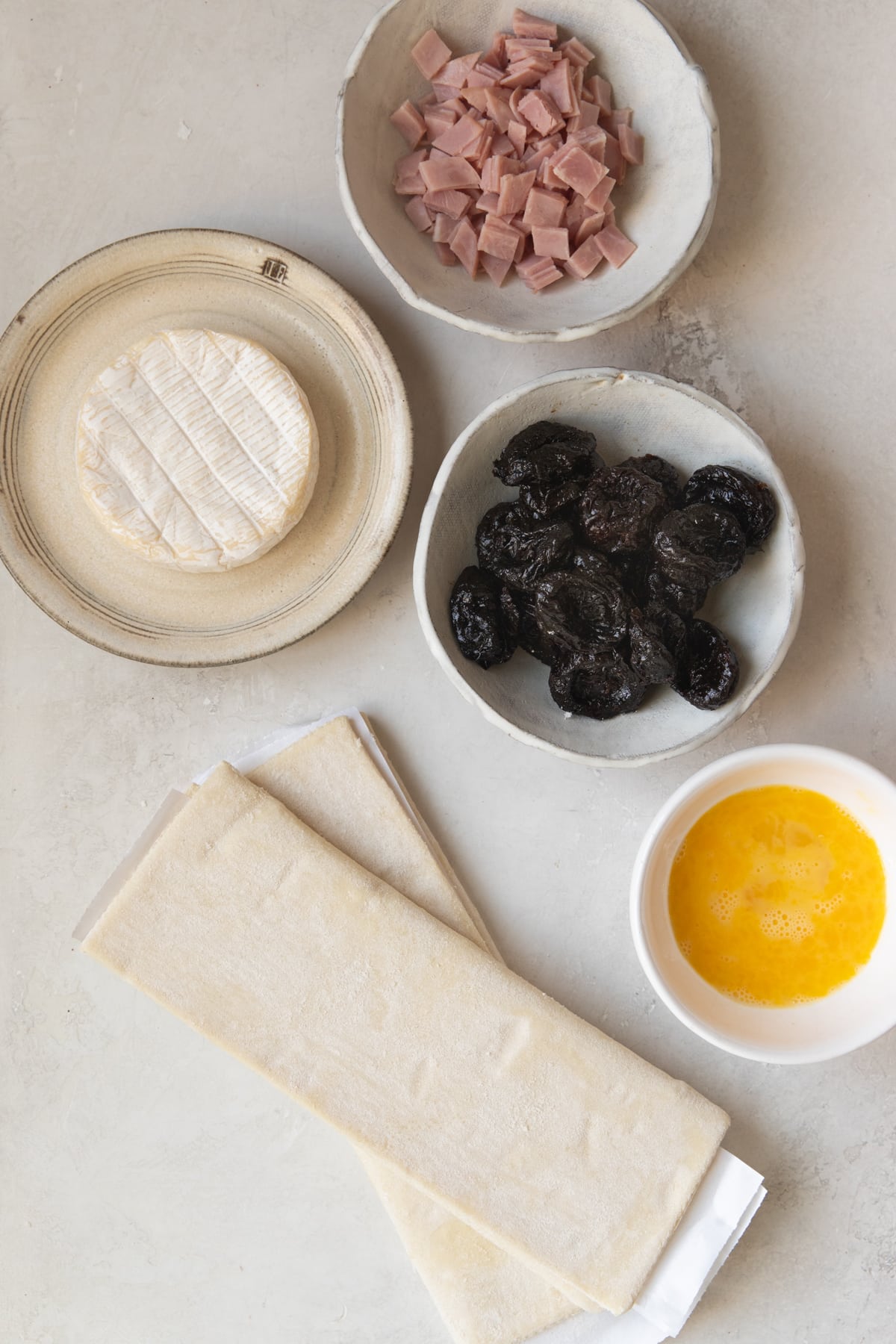 ingredients in glass bowls needed to make puff pastry wraps.