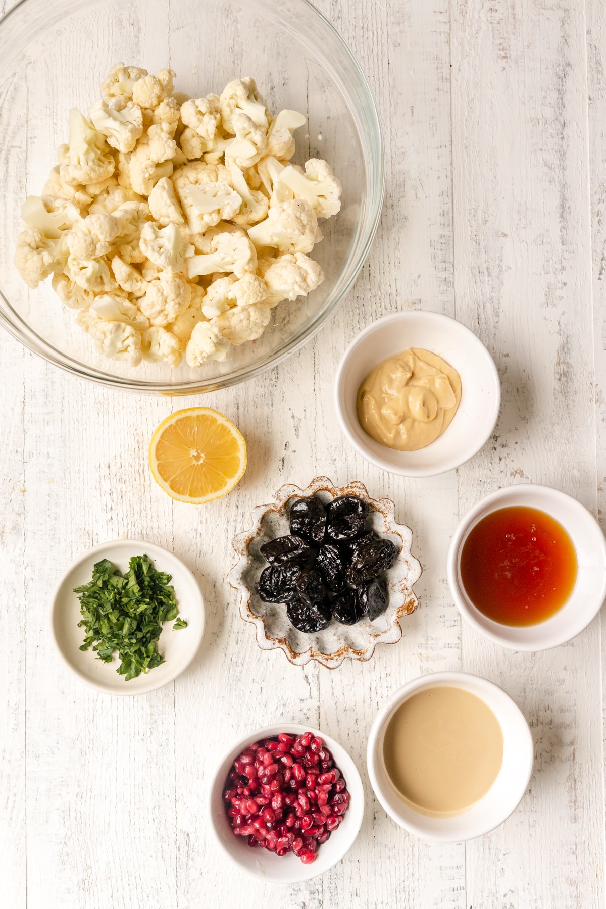 ingredients to make cauliflower in small bowls. 