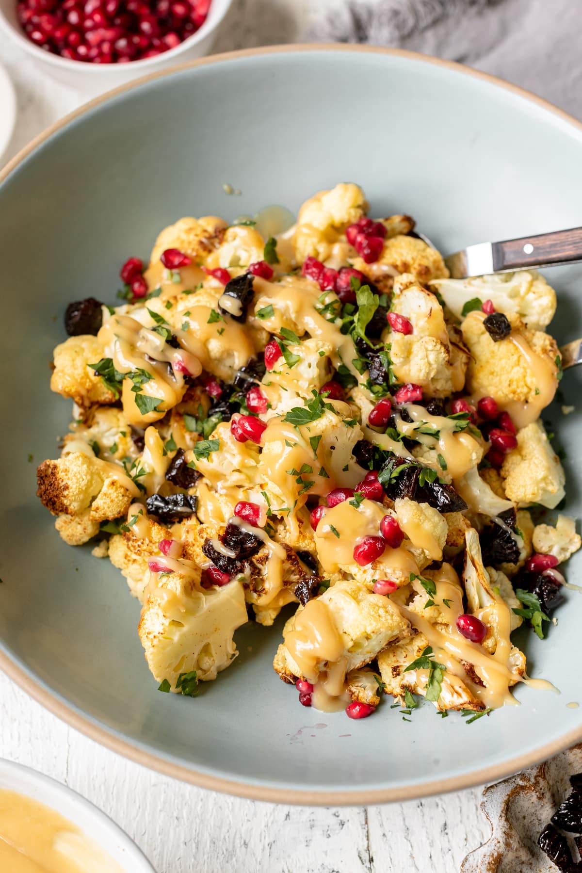 cauliflower drizzled in a mustard sauce with pomegranate perils & green spices