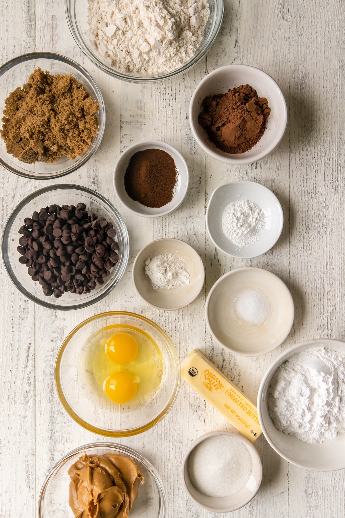 ingredients to make cookies in glass bowls 