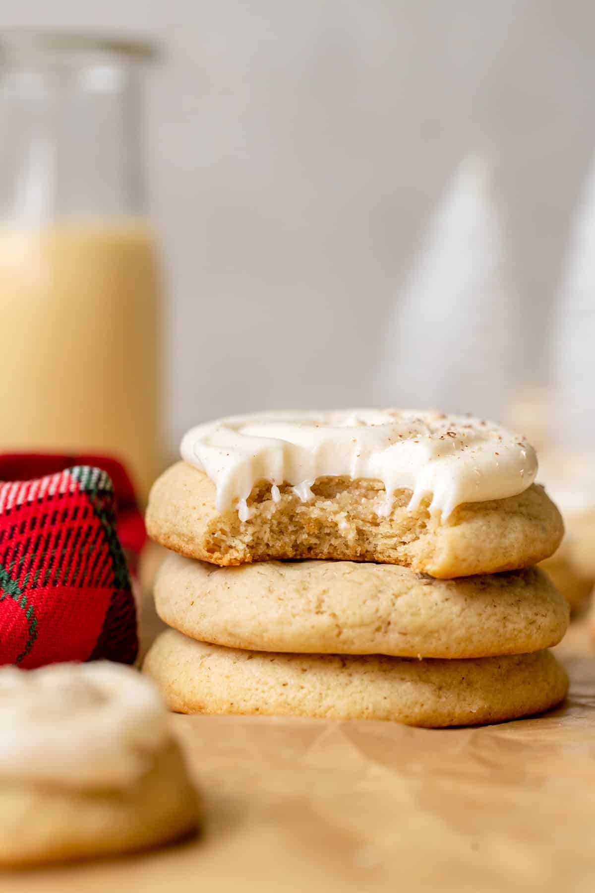 cookies stacked on top of each other with a bite taken out of the cookie on top. 