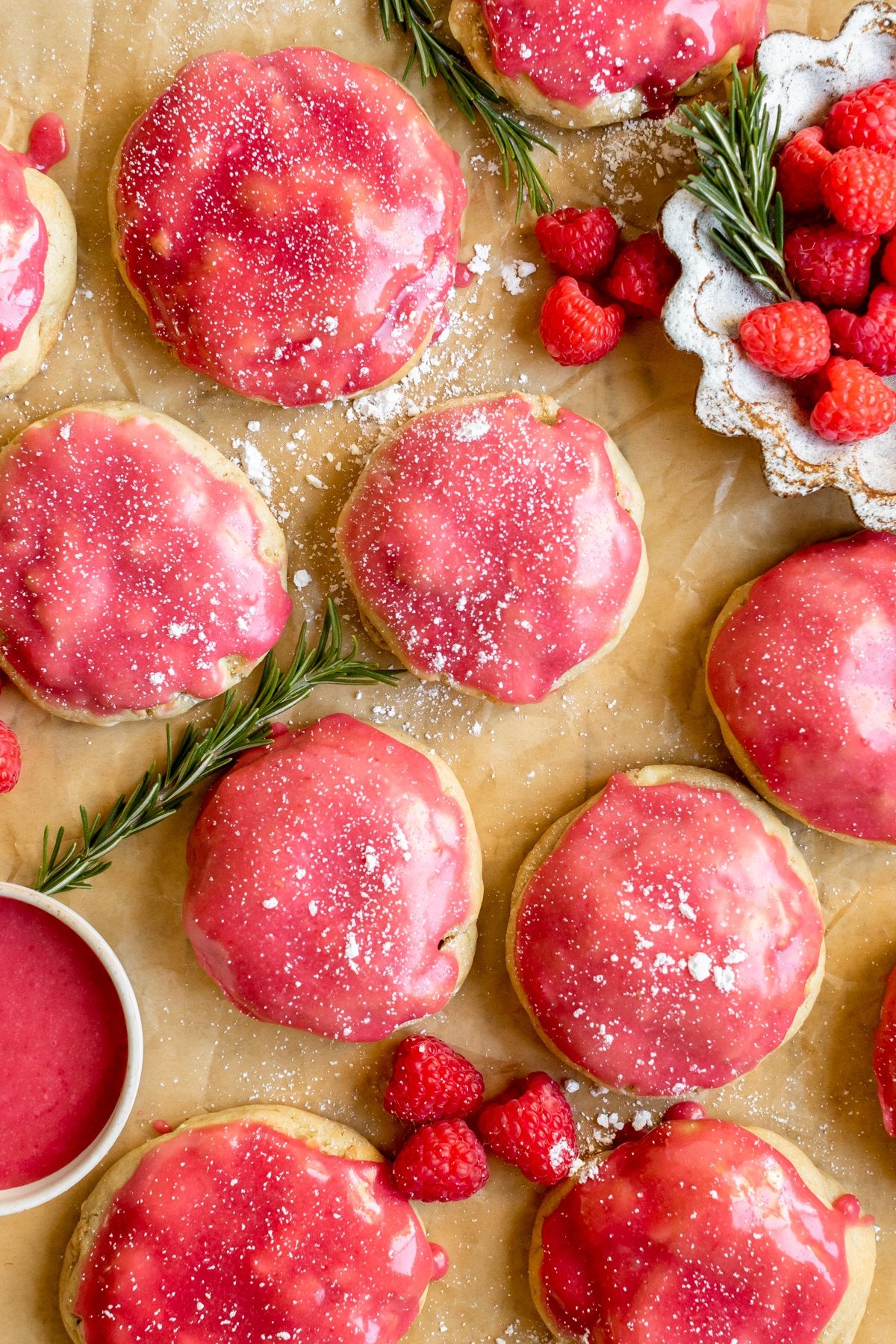 cookies made with a raspberry glaze and garnished with powdered sugar. 