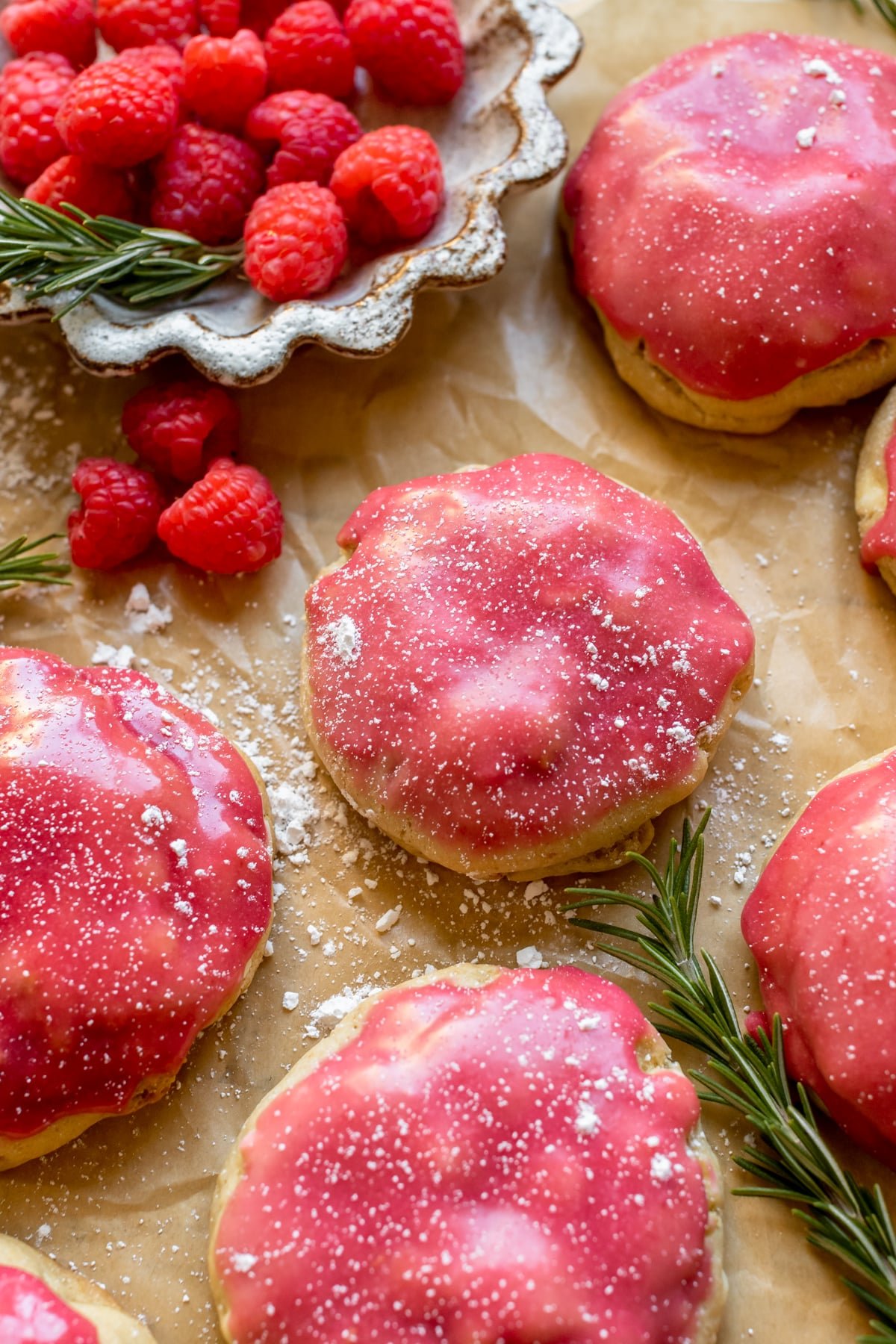 cookies with raspberry glaze and powdered sugar on top. 