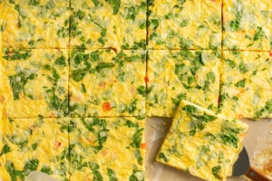 sheet pan with cooked eggs and vegetables cut into squares