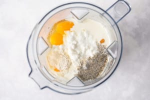 eggs, spices, cottage cheese in a clear blender