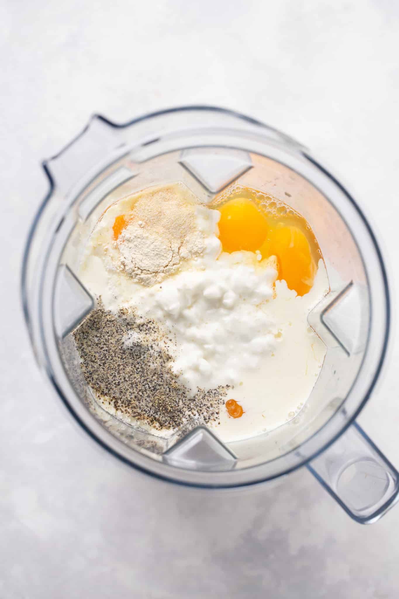 eggs in a blender with cottage cheese, garlic powder and black pepper. 