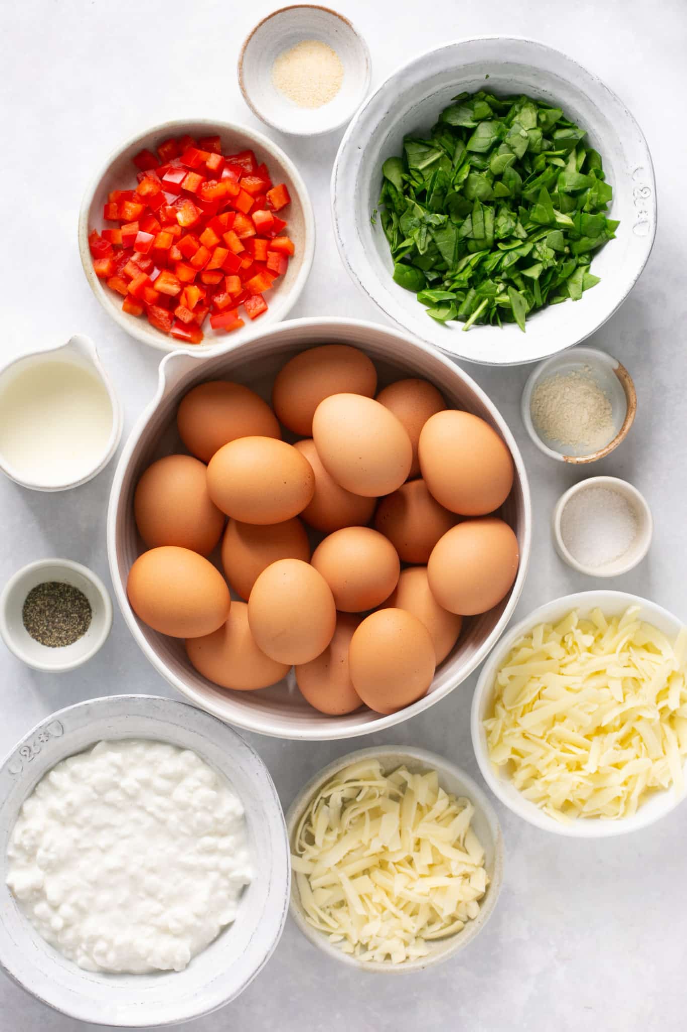ingredients in small bowls needed to make sheet pan eggs. 