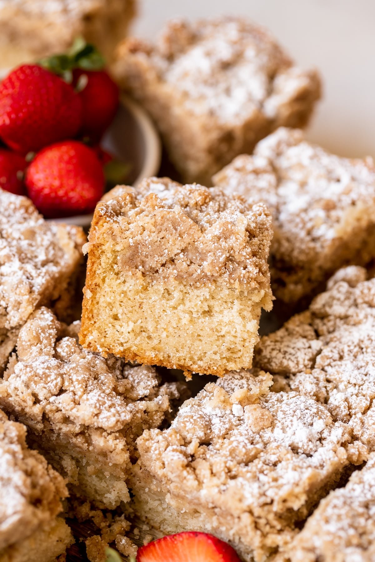 crumb cake with powdered sugar on top. 