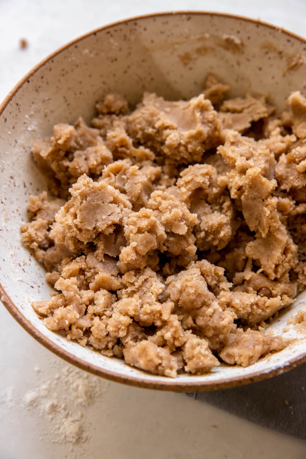 an up close image of the crumb topping in a bowl.