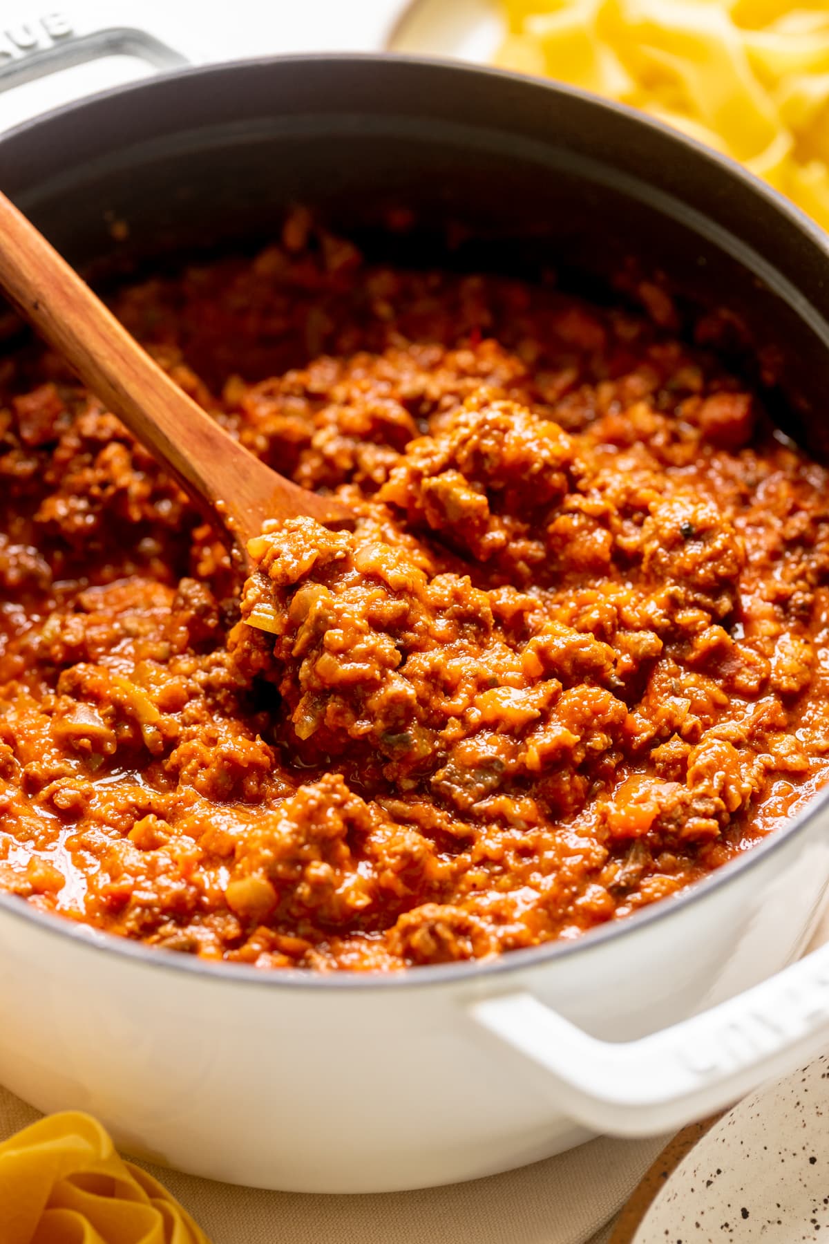 bolognese in a white dutch oven.