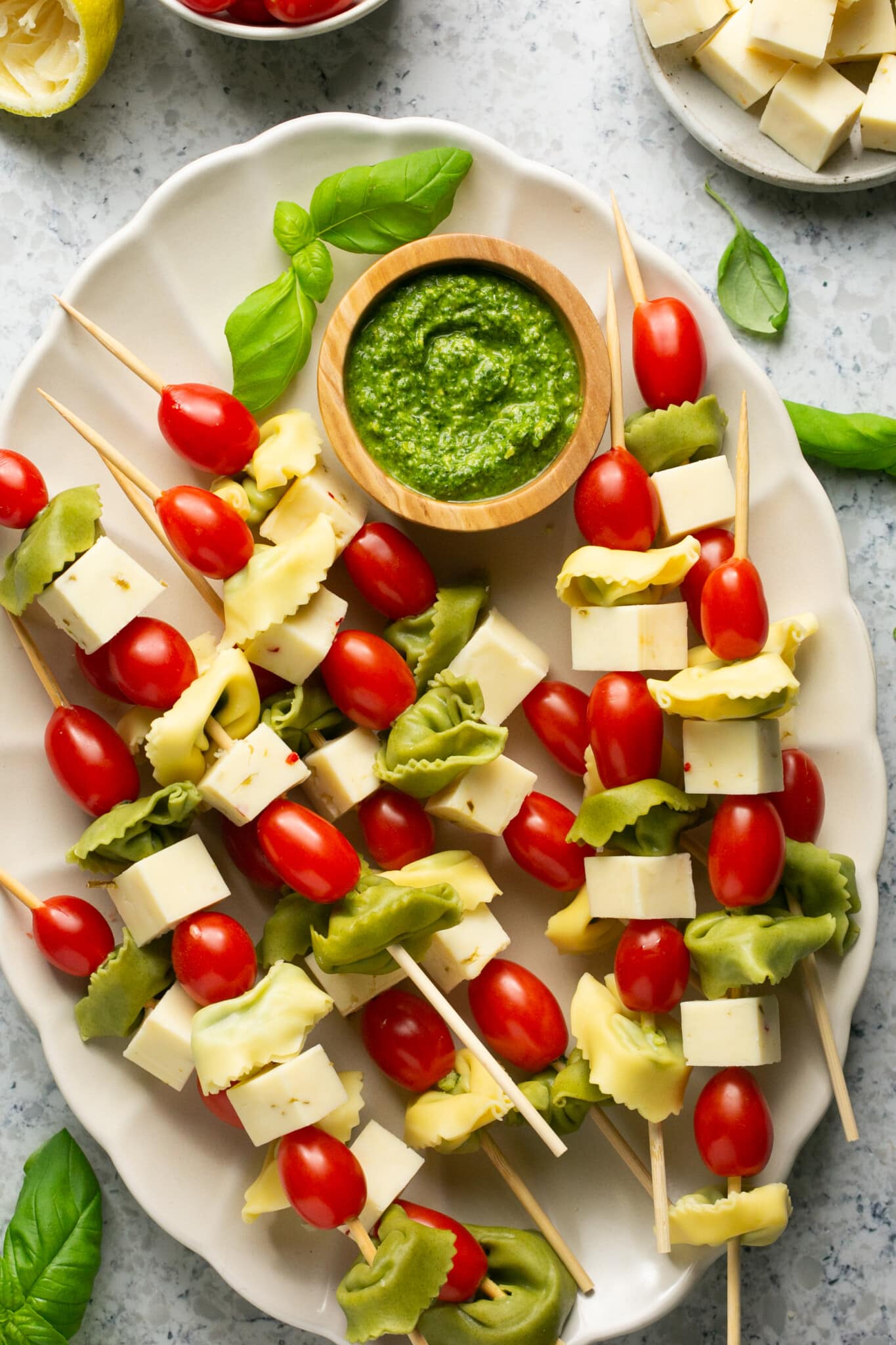 tortellini on skewers with cheese and cherry tomatoes. 