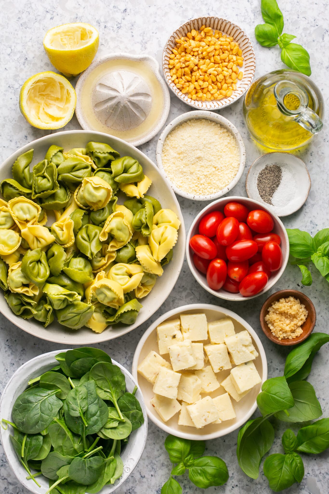 ingredients to make pasta skewers in small bowls. 