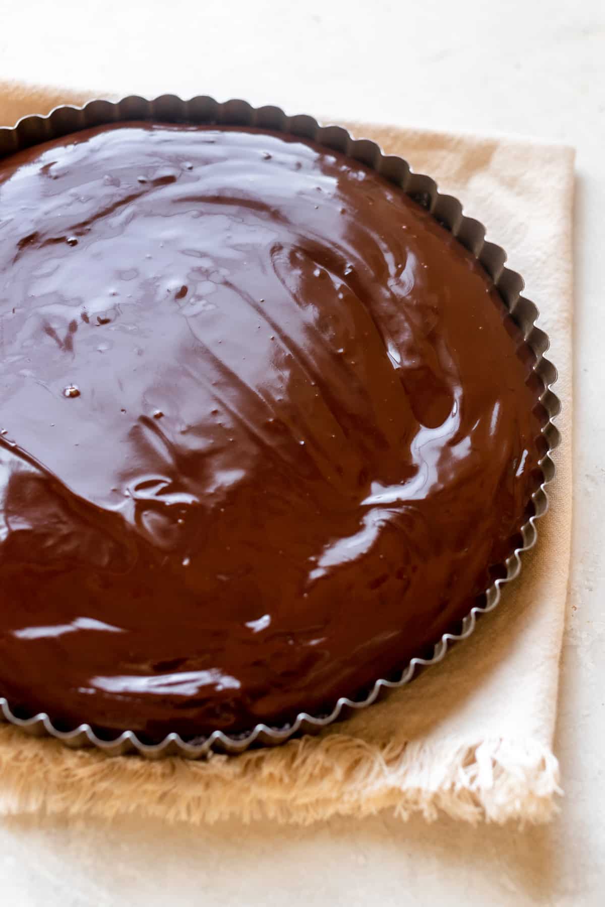 chocolate filling poured into a tart pan. 
