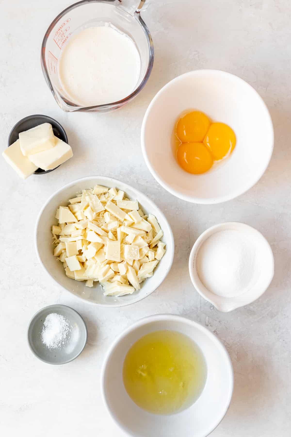 ingredients to make mousse in small white bowls. 