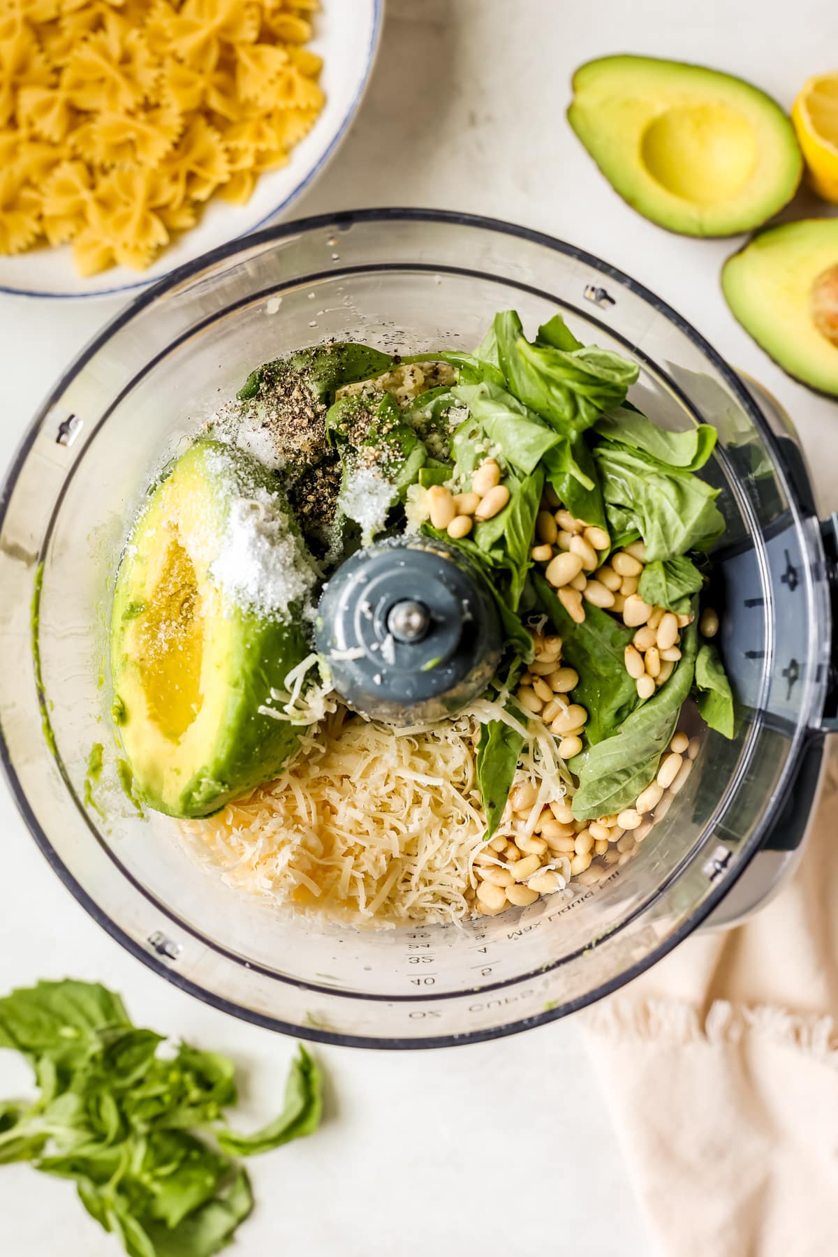 ingredients to make pesto in a food processor. 