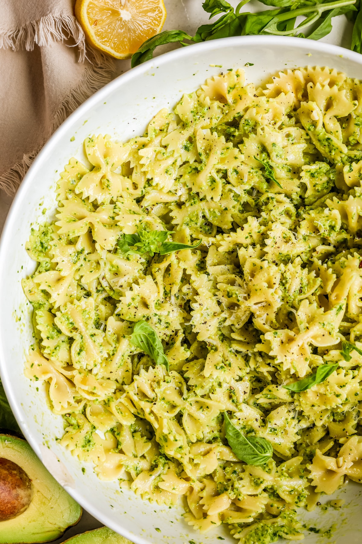 pesto pasta in a large white bowl.