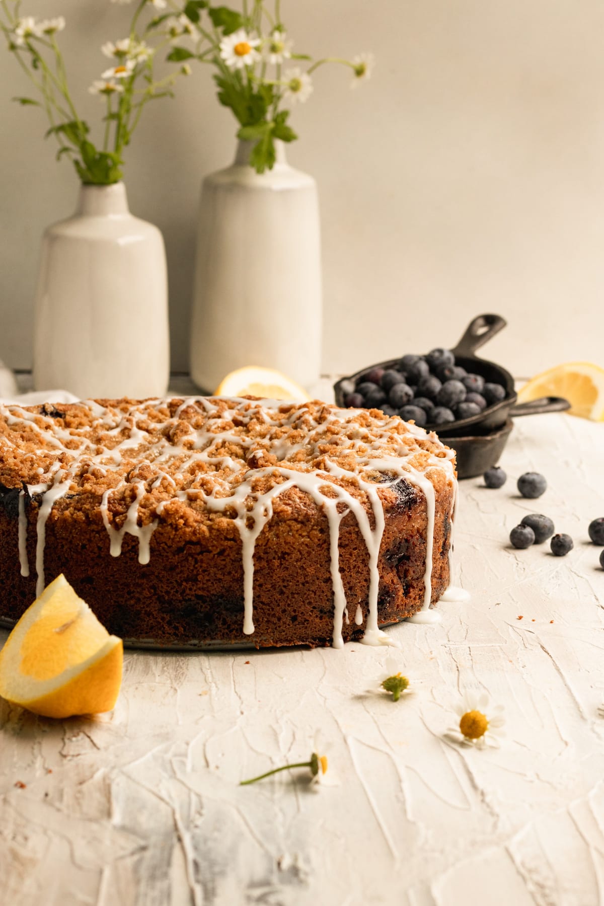 blueberry coffee cake with glaze on top.