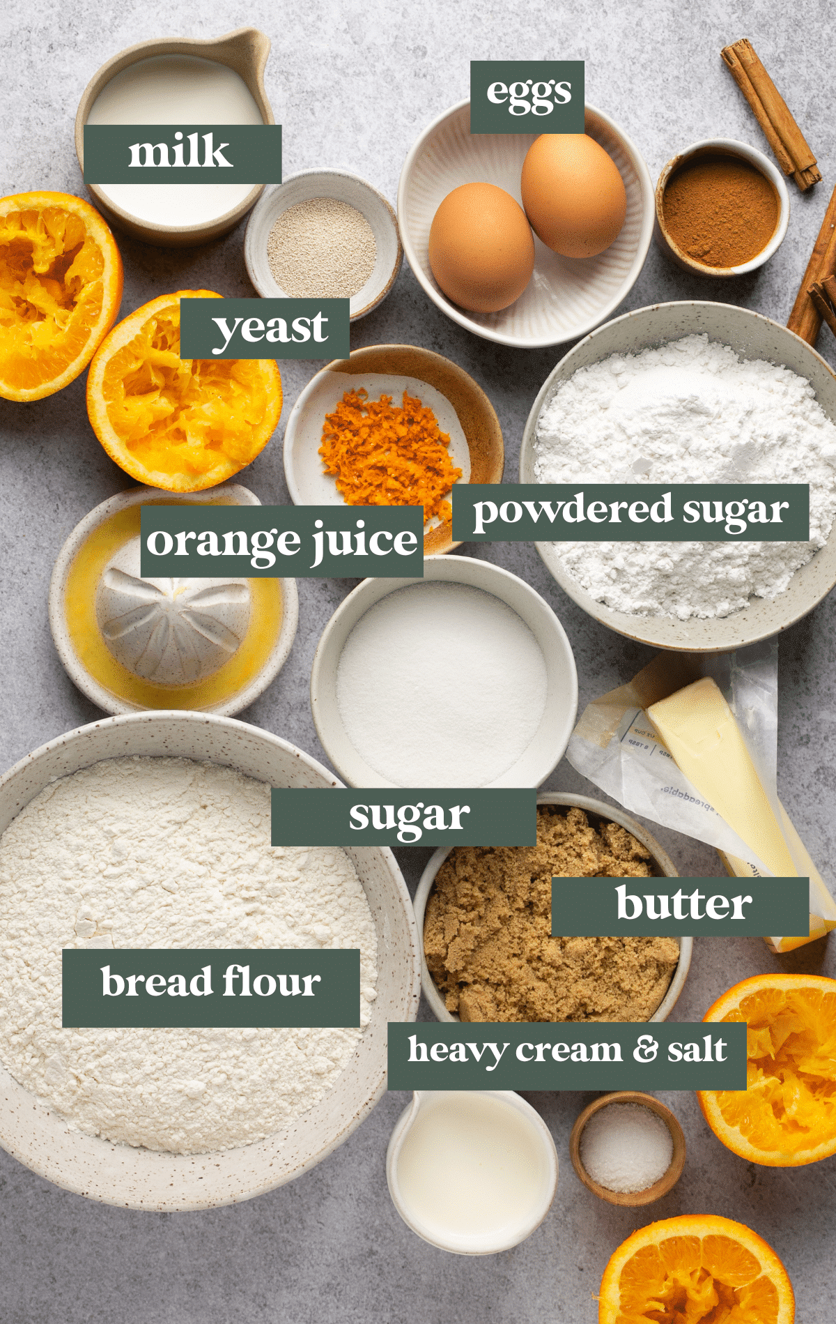 ingredients in small bowls needed to make cinnamon rolls with oranges. 