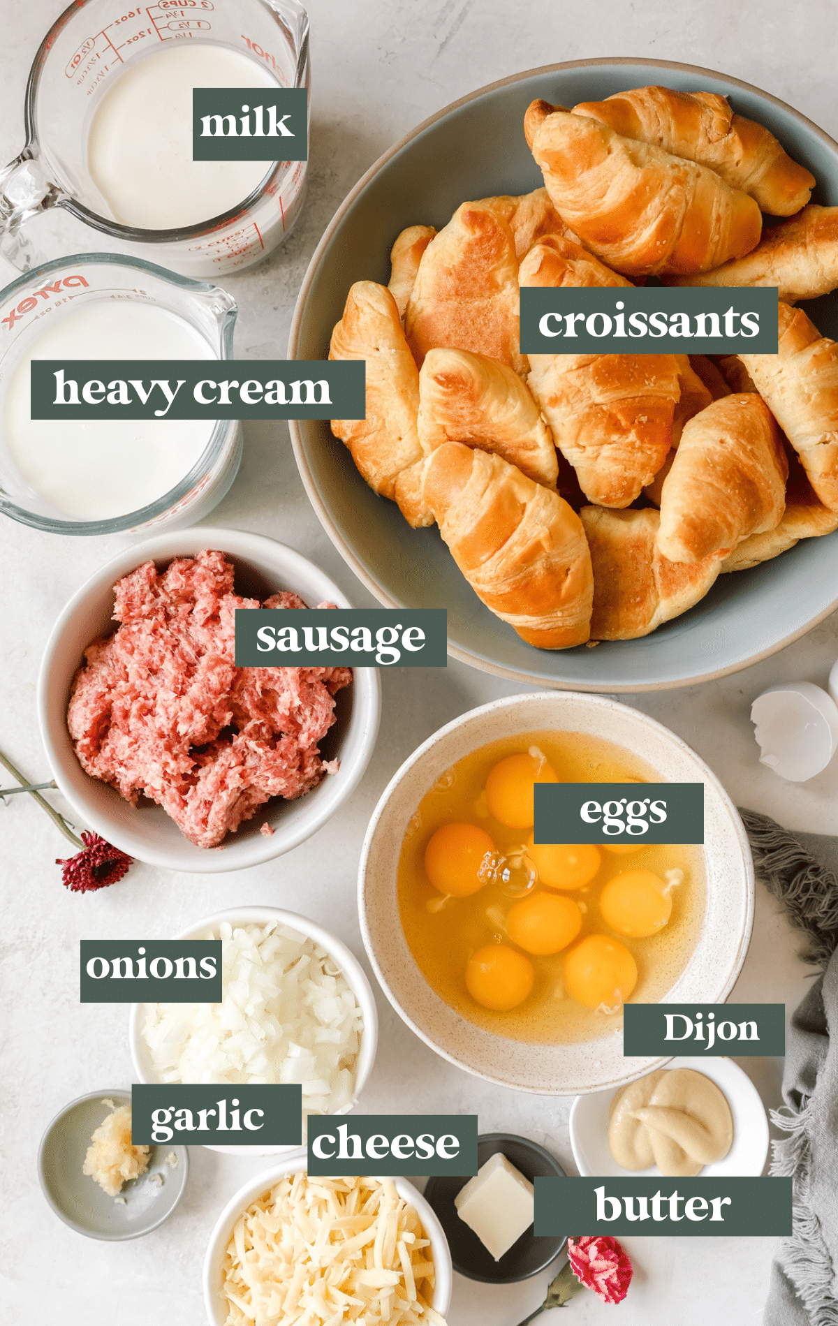 ingredients to make a breakfast casserole in glass bowls. 