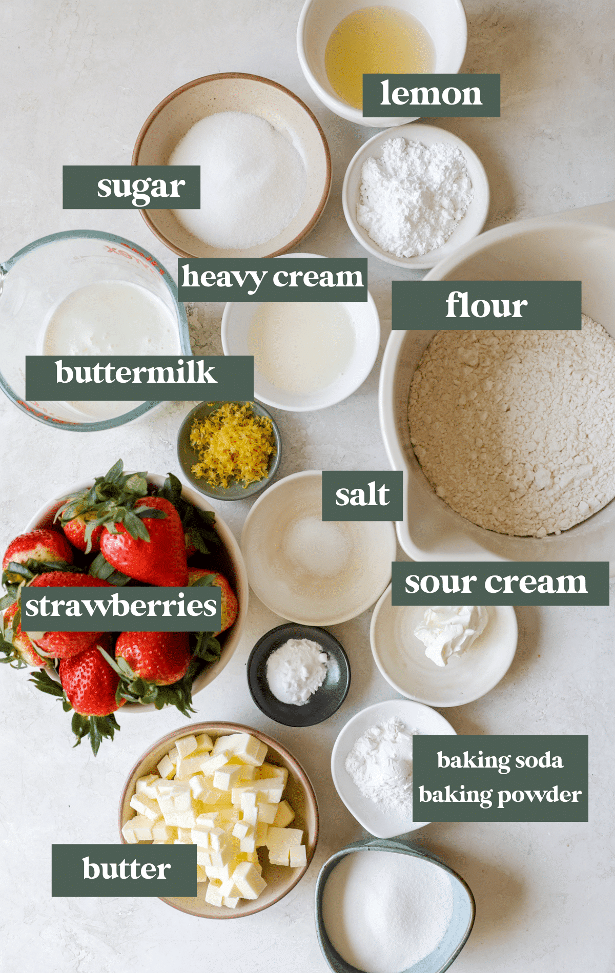 ingredients in small glass bowls needed to make shortcakes. 