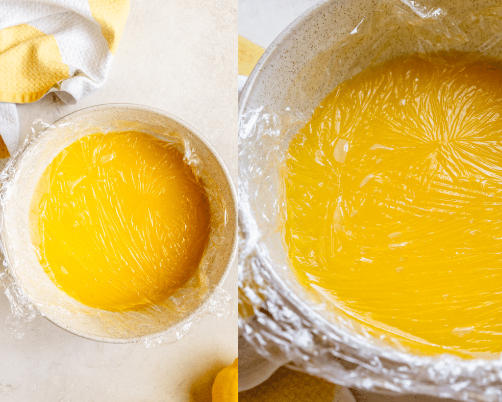 plastic wrap on top of lemon curd in a bowl. 