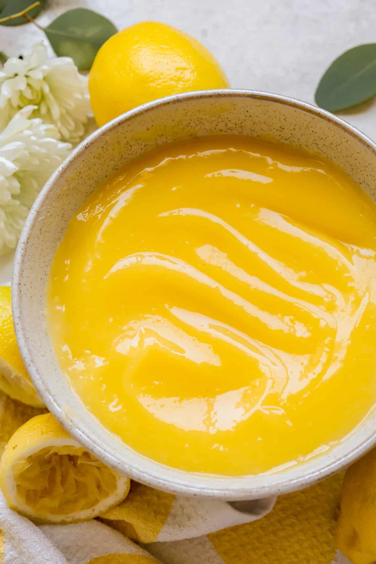 a bowl filled with lemon curd. 